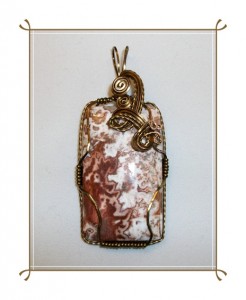 Judy Ellis's Gem Profile- Thundereggs and Mexican Lace Agate - , General Education, , A crazy lace rosetta stone cabochon wrapped in bronze wire 