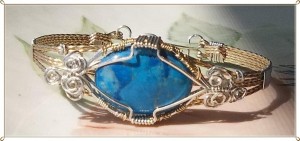 Judy Ellis's Gem Profile- Howlite - , General Education, , Turquoise howlite cabochon in a bracelet with sterling silver and 14kt gold filled wire.