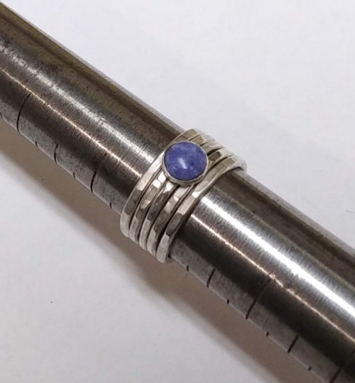 Dale Armstrong's What Gauge of Wire Should I Use to Make Jewelry - , General Education, Design, , Assorted textured stack rings in various sizes displayed on a ring mandrel
