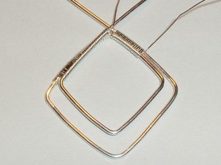 Abby Hook's Squares Bracelet - , Contemporary Wire Jewelry, Wire Wrapping, Wrapping, Wire Wrapping Jewelry, Weaving, Wire Weaving, Weaving Wire, Keep coiling the 2 thick wires
