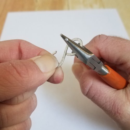 Debbie Blair's Winter Fields Necklace - , Contemporary Wire Jewelry, Forging, Forging Jewelry, Jewelry Forging, Loops, Wire Loop, Wrapped Wire Loop, Texturing, Use the round nose pliers to close