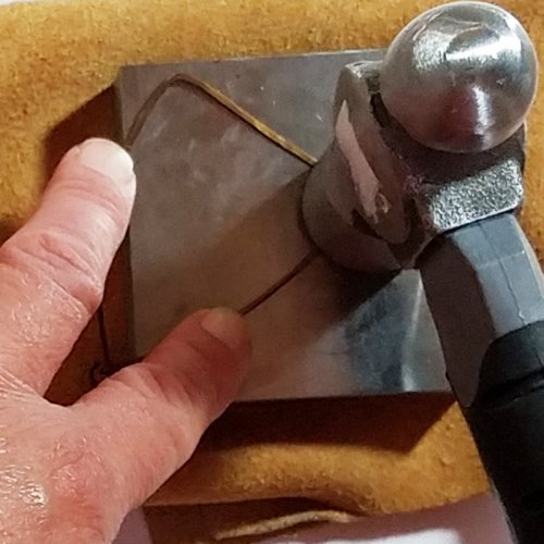 Debbie Blair's Beaded Wire Bird Pendant - , Contemporary Wire Jewelry, Forging, Forging Jewelry, Jewelry Forging, Lashing, Wire Lashing, Beads, Place the pendant on a bench block 