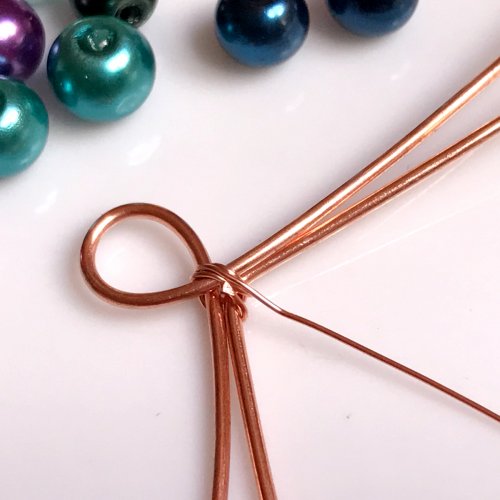 Erika Pal's Xs and Os Beaded Wire Bracelet - , Contemporary Wire Jewelry, Lashing, Wire Lashing, Loops, Wire Loop, Wrapped Wire Loop, Weaving, Wire Weaving, Weaving Wire, Beads, , Wrap the initial end of the weaving wire 3 times 