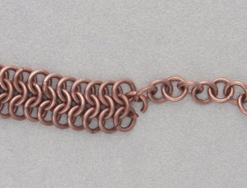 Kylie Jones's Copper Braided Chain Maille Bracelet - , Chain Maille Jewelry, Making Chain, Chain Making , Oxidizing Wire, Oxidizing, Antiquing Wire, Antiquing, place the end copper ring from one of the longer 1-in-1 chains inside the ring