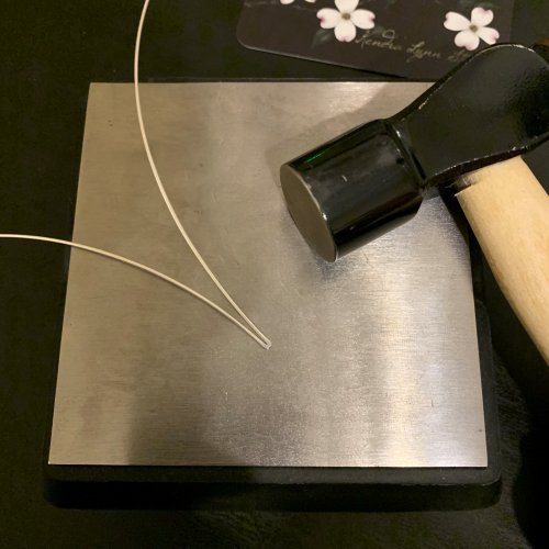 Kendra Austin's Filigree Heart Pendant - Shape the First Point, Contemporary Wire Jewelry, Weaving, Wire Weaving, Weaving Wire, ball-peen hammer to flatten the folded end of the second wire