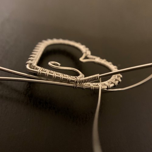 Kendra Austin's Filigree Heart Pendant - Attach the Top to the Bottom, Contemporary Wire Jewelry, Weaving, Wire Weaving, Weaving Wire, Wrap the bottom weaving wire around the remaining bottom wire