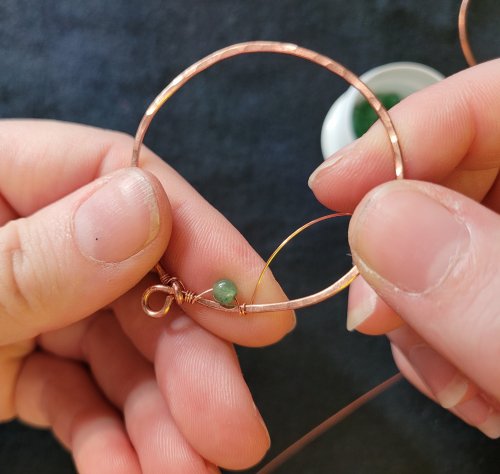 Jennifer Brooks's Dyer's Mushroom Netted Hoop Pendant - , Contemporary Wire Jewelry, Lashing, Wire Lashing, Wire Wrapping, Wrapping, Wire Wrapping Jewelry, , Thread the free end through the loop with the bead