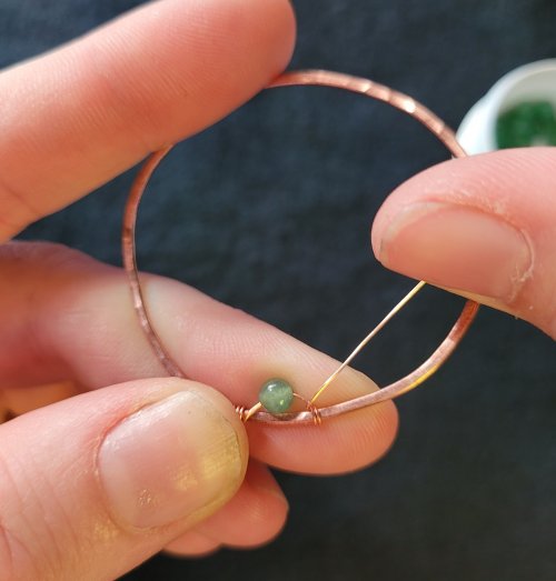 Jennifer Brooks's Dyer's Mushroom Netted Hoop Pendant - , Contemporary Wire Jewelry, Lashing, Wire Lashing, Wire Wrapping, Wrapping, Wire Wrapping Jewelry, , cross over the top of the bottom wire of the bead-loop