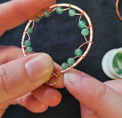 Jennifer Brooks's Dyer's Mushroom Netted Hoop Pendant - , Contemporary Wire Jewelry, Lashing, Wire Lashing, Wire Wrapping, Wrapping, Wire Wrapping Jewelry, , Cross the weaving wire over the bottom of the first bead-loop wire