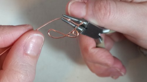 Elizabeth Schultz's Butterfly Swirly Wire Earrings - , Contemporary Wire Jewelry, Coiling, Coiling Wire, Wire Coiling, Lashing, Wire Lashing, Loops, Wire Loop, Wrapped Wire Loop, Wire Wrapping, Wrapping, Wire Wrapping Jewelry, Hold the wire with your round nose pliers