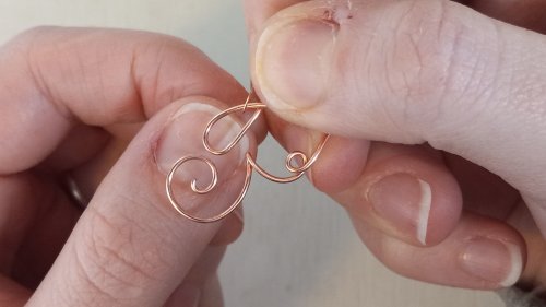 Elizabeth Schultz's Butterfly Swirly Wire Earrings - , Contemporary Wire Jewelry, Coiling, Coiling Wire, Wire Coiling, Lashing, Wire Lashing, Loops, Wire Loop, Wrapped Wire Loop, Wire Wrapping, Wrapping, Wire Wrapping Jewelry,  run it through the body of the butterfly.    