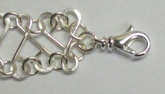 Judy Larson's Heart Link Bracelet and Earrings - , Contemporary Wire Jewelry, Making Chain, Chain Making , Jump Rings, Jump Ring, Making Jump Rings, Loops, Wire Loop, Wrapped Wire Loop, Texturing, Wire Wrapping, Wrapping, Wire Wrapping Jewelry, Closing the piece with a lobster claw and large closed ring.