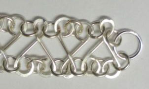 Judy Larson's Heart Link Bracelet and Earrings - , Contemporary Wire Jewelry, Making Chain, Chain Making , Jump Rings, Jump Ring, Making Jump Rings, Loops, Wire Loop, Wrapped Wire Loop, Texturing, Wire Wrapping, Wrapping, Wire Wrapping Jewelry, Closing the piece with a lobster claw and large closed ring.