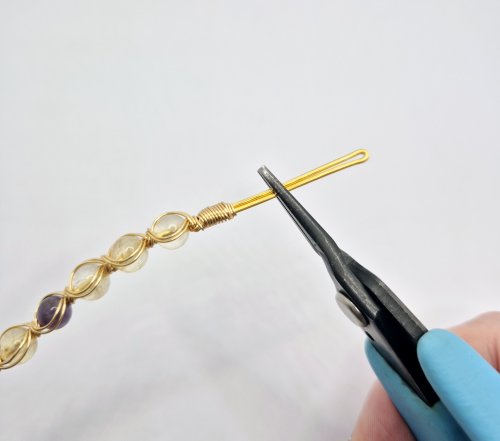 Natalie Patten's Bead and Wire Bracelet with Attached Clasp - , Contemporary Wire Jewelry, Wire Wrapping, Wrapping, Wire Wrapping Jewelry, place round-nose pliers in the center of the hook wires