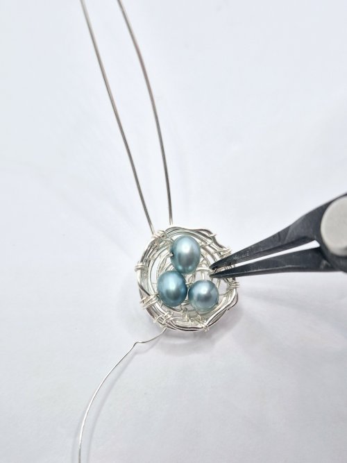 Natalie Patten's Birds Nest Pendant - , Contemporary Wire Jewelry, Wire Wrapping, Wrapping, Wire Wrapping Jewelry, Weaving, Wire Weaving, Weaving Wire, Tuck tail end to the frame
