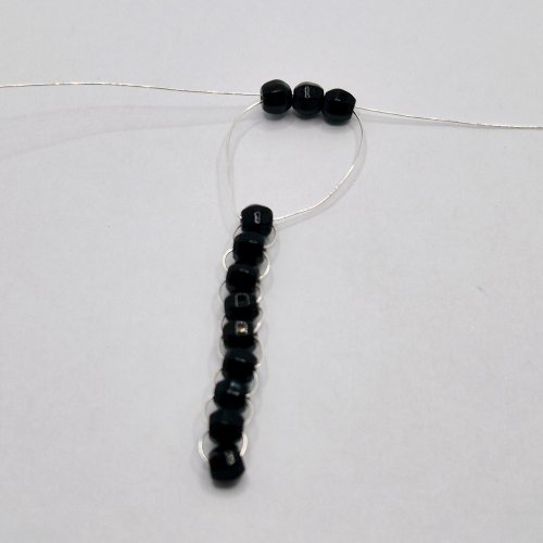 Natalie Patten's The Purrfect Feline Pendant - , Contemporary Wire Jewelry, Loops, Wire Loop, Wrapped Wire Loop, Weaving, Wire Weaving, Weaving Wire, Beads, Add three beads to one of the wire tails
