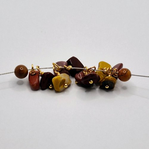Natalie Patten's Wrapped Loop Charm Bramble - , Beading, Loops, Wire Loop, Wrapped Wire Loop, Design, Beads, Thread a bead onto the Tigertail