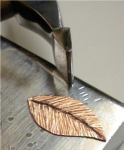 Judy Larson's Tab Style Pendant - , Metalwork, Coiling, Coiling Wire, Wire Coiling, Cutting, Cutting Tool, Cutters, Dapping, Dapping Jewelry, Filing, Finishing, How To Punch Holes, Hole Punching, Punch A Hole, Oxidizing Wire, Oxidizing, Antiquing Wire, Antiquing, Riveting, Riveting Techniques, Wire Rivets, Sawing, Saw, Wire Saw, Texturing, Butane Torch, Soldering, Solder, Using the narrower side of the Mini TruStrike Sharp Designer Hammer to texture