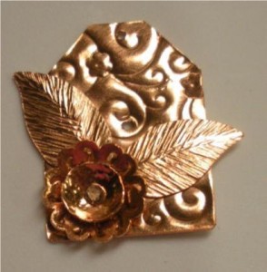 Judy Larson's Tab Style Pendant - , Metalwork, Coiling, Coiling Wire, Wire Coiling, Cutting, Cutting Tool, Cutters, Dapping, Dapping Jewelry, Filing, Finishing, How To Punch Holes, Hole Punching, Punch A Hole, Oxidizing Wire, Oxidizing, Antiquing Wire, Antiquing, Riveting, Riveting Techniques, Wire Rivets, Sawing, Saw, Wire Saw, Texturing, Butane Torch, Soldering, Solder, Riveting the pieces