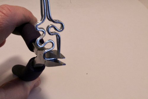 Judy Freyer Thompson's Jigsaw Puzzle Earrings - , Contemporary Wire Jewelry, Forging, Forging Jewelry, Jewelry Forging, Texturing, Wire Wrapping, Wrapping, Wire Wrapping Jewelry, Adjust and trim the wires