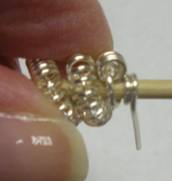 Judy Larson's How to Make a Wire Coil and Bead - , Classic Wire Jewelry, Coiling, Coiling Wire, Wire Coiling, Findings, Clasps, Components, Wire Wrapping, Wrapping, Wire Wrapping Jewelry, Finished end of coil