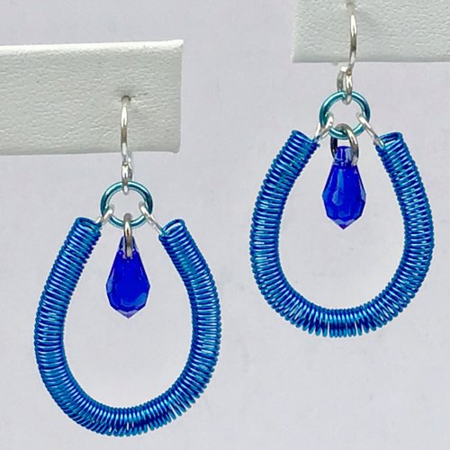 Kristal Wick's Coiled Blue Earrings, Contemporary Wire Jewelry. Coiling, Coiling Wire, Wire Coiling, Loops, Wire Loop, Wrapped Wire Loop. A quick and easy earring project you'll want in every color! I'm in love with the new Majestic Blue color Swarovski just launched and wanted to feature a simple drop accenting this beautiful blue.