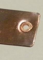 Judy Larson's Using Tiles on Tube Rivets and Eyelets - Step 4, Metalwork, How To Punch Holes, Hole Punching, Punch A Hole, Riveting, Riveting Techniques, Wire Rivets, Design, Tools, Finished back side of copper rivet tube