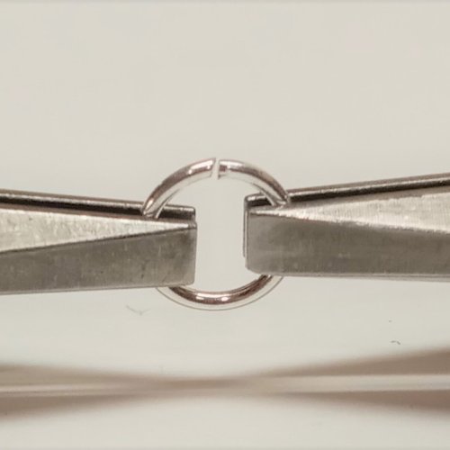 Judy Larson's Coiling Wire for Jump Rings - , General Education, Jump Rings, Jump Ring, Making Jump Rings, close up of jump ring between two pliers