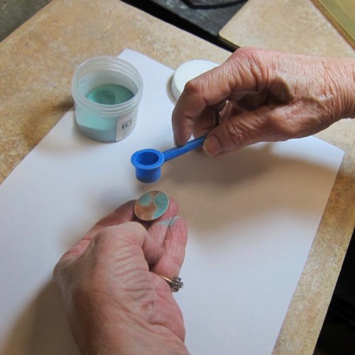 Sifting Enamel onto a Curved Surface